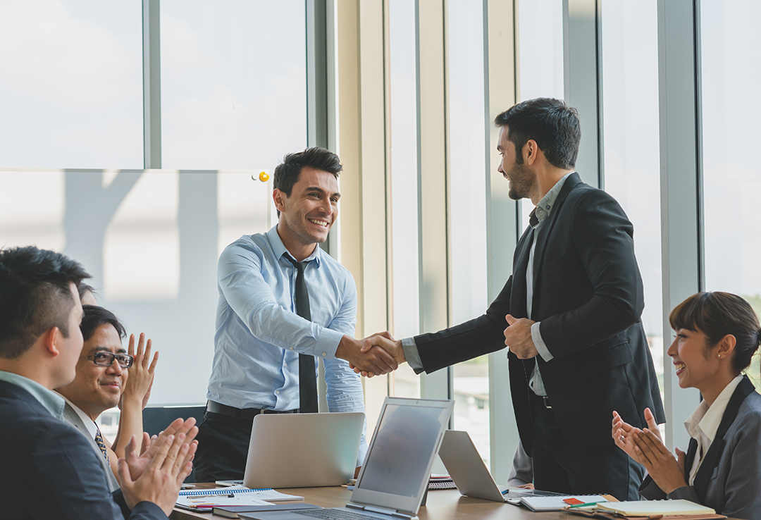 Why-We-Exist-business-people-shaking-hands-congratulations-work-success